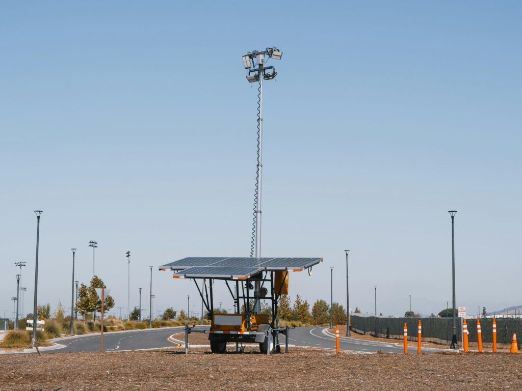Solar powered streetlights under a clear blue sky, emphasizing renewable energy.